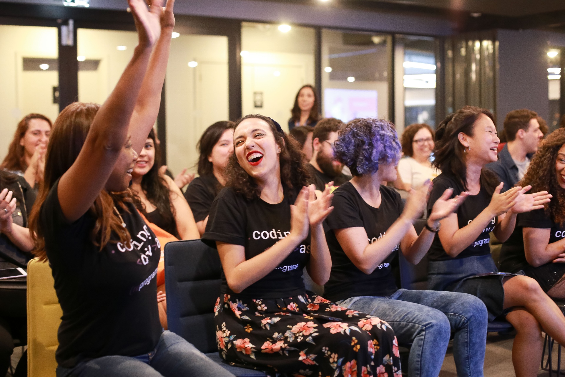 reprograma students celebrating together at a graduation event