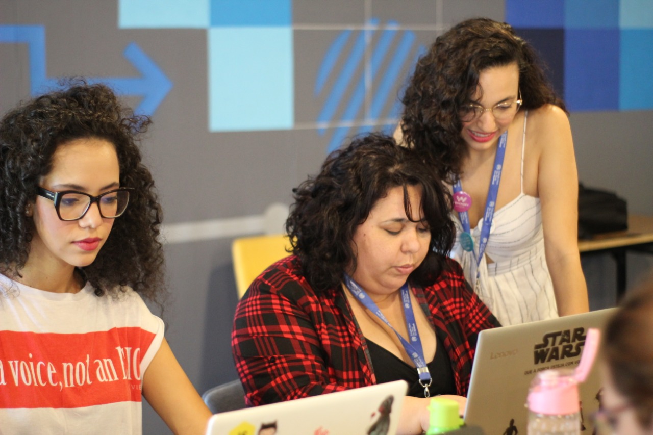 Students collaborating on a laptop