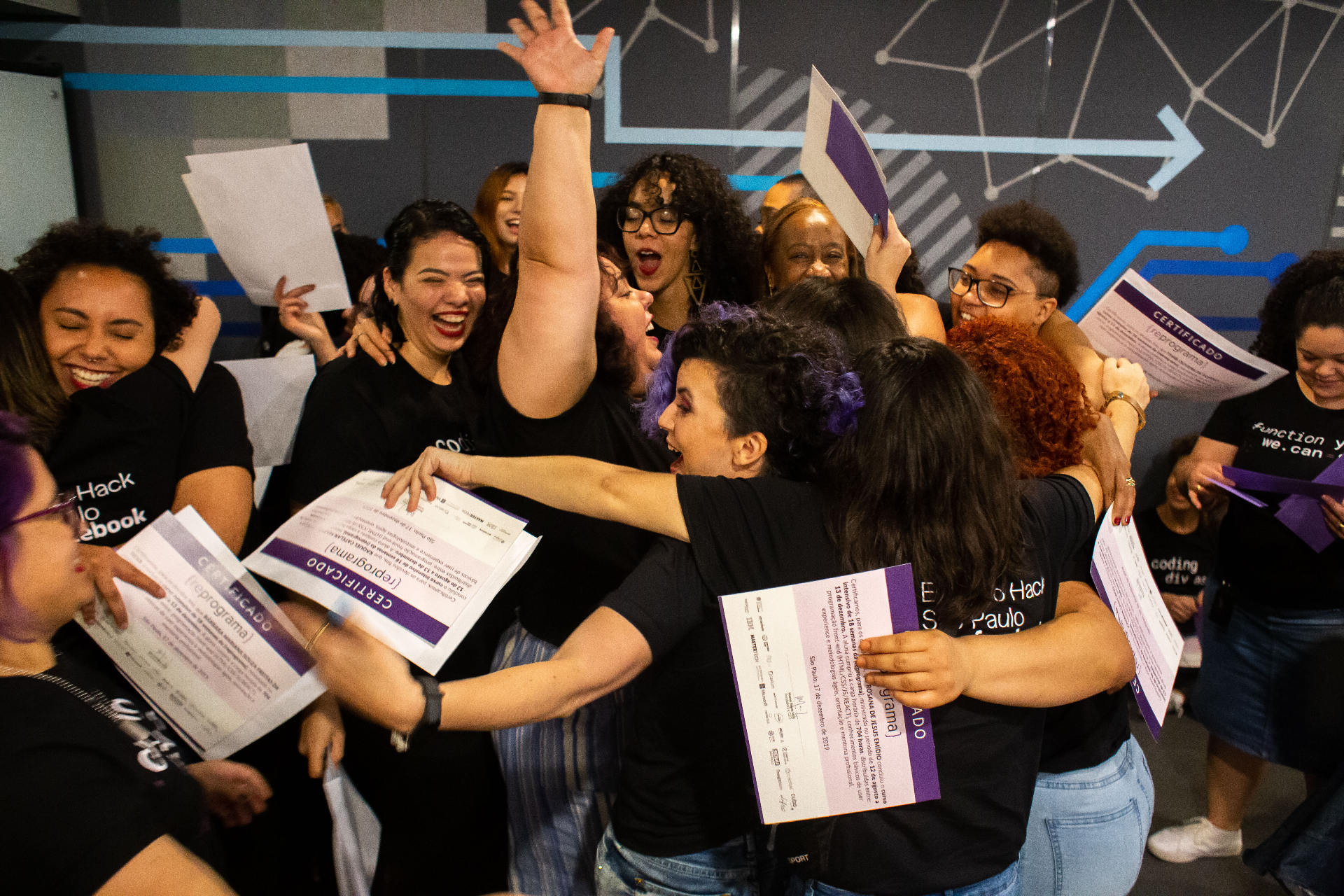 Graduates throwing certificates in the air